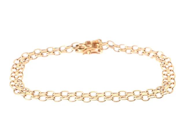 ARMBAND, 18K guld, x-länk, längd 17 cm, kistlås, säkerhetsåttor, vikt ca 5,6 g.