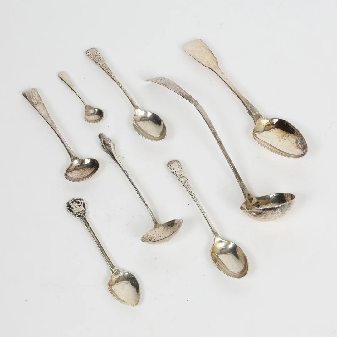 EIGHT SILVER SPOONS TO INCLUDE A SAUCE LADLE (8). — Silver — Bishop & Miller