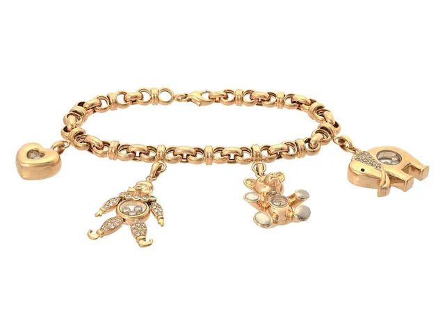 CHOPARD, armband med 4 berlocker, Happy Diamonds, 18K guld, safir, briljant- och åttkantslipade diamanter ca 1,00 ctv, refnr 85/2179, serienr 9133724, längd 21,5 cm, vikt 59,8 g.