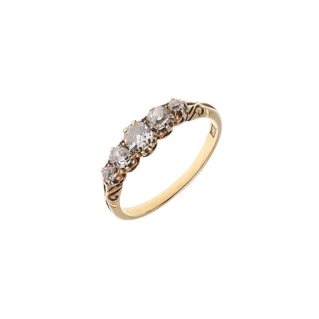 A DIAMOND FIVE STONE RING.