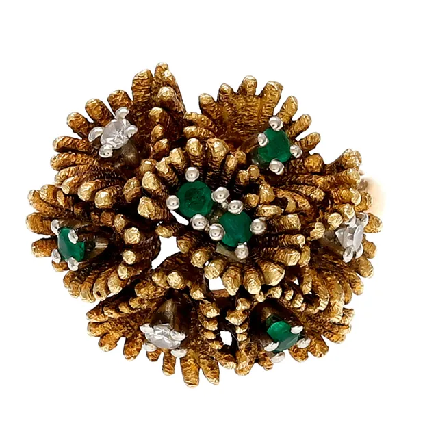 Emeralds and diamonds floral ring, circa 1960.