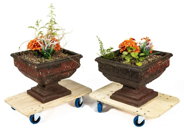 A PAIR OF SQUARE FORM RECONSTITUTED STONE GARDEN PLANTERS.