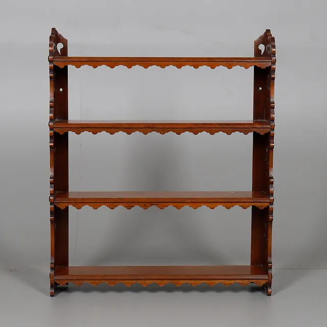 A FLIGHT OF VICTORIAN HANGING WALL SHELVES.