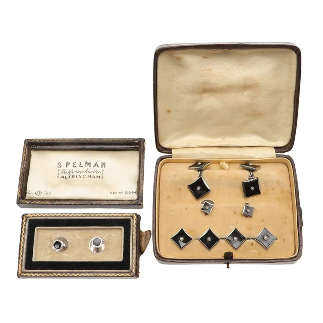 A PAIR OF BLACK ONYX AND 9CT WHITE GOLD DRESS STUDS.