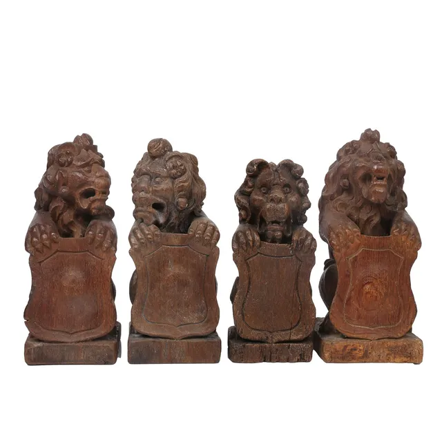 A SET OF FOUR LATE 16TH/EARLY 17TH CENTURY CARVED OAK NEWEL POST FINIALS (4).