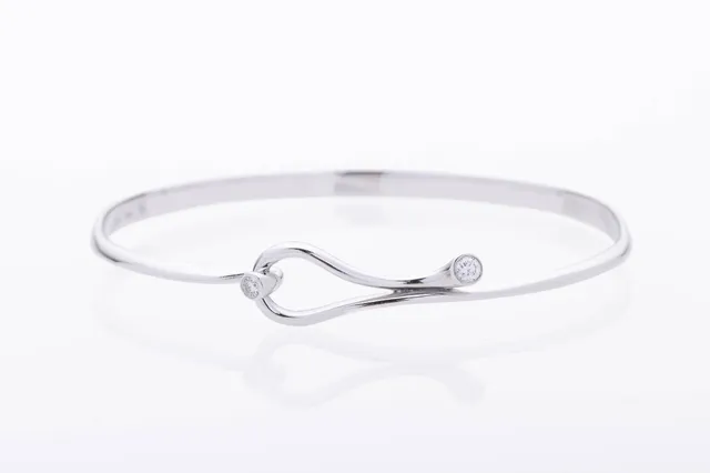 Regitze Overgaard for Georg Jensen: A 'Magic' bangle of 18k white gold, total 0.12 ct. Size M.