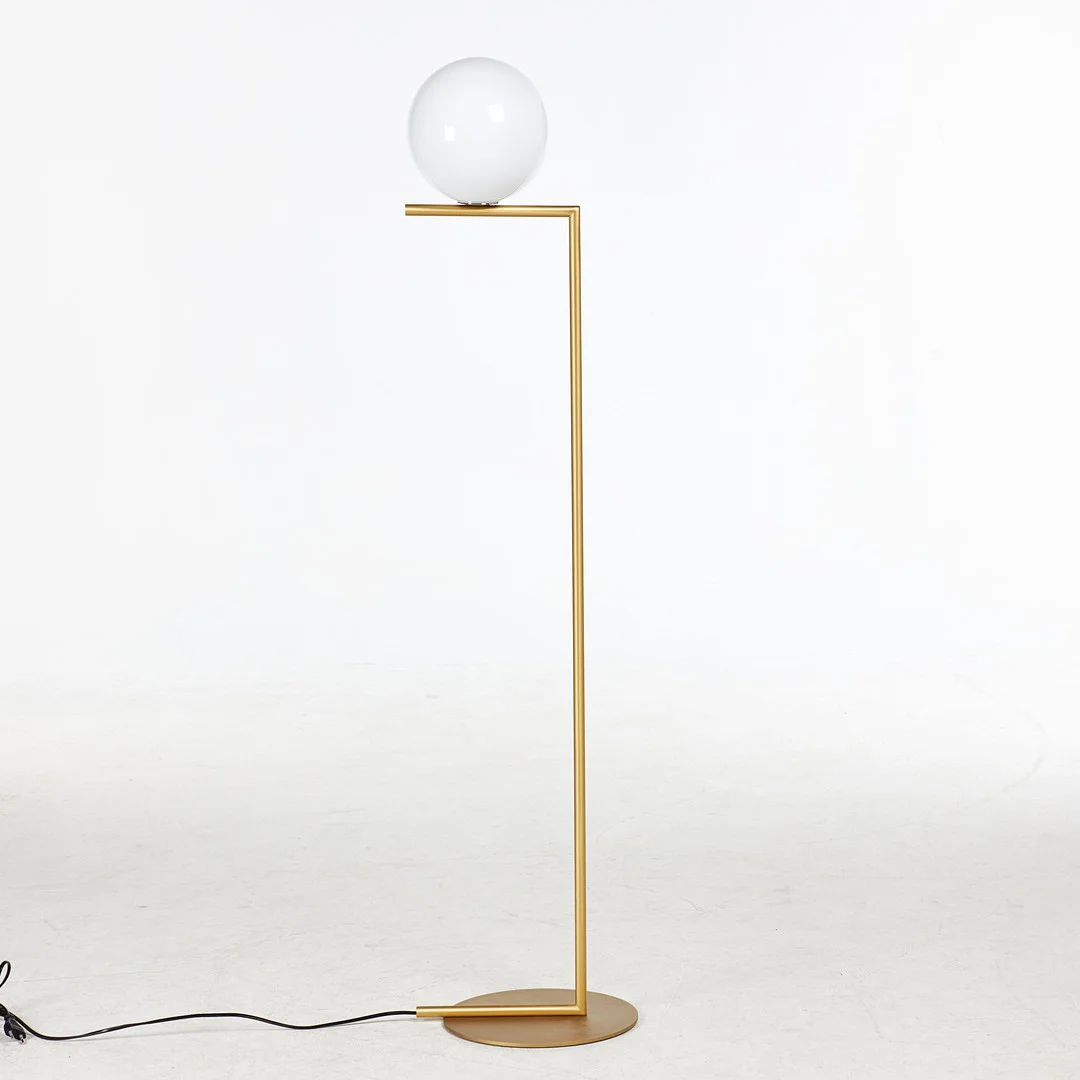 MICHAEL ANASTASSIADES. "'IC Lights F1'' golvlampa, Flos, klotformad skärm av opalglas, stomme i borstad mässing, samtida tillverkning. — Floor lights — Stockholms Auktionsverk Sickla