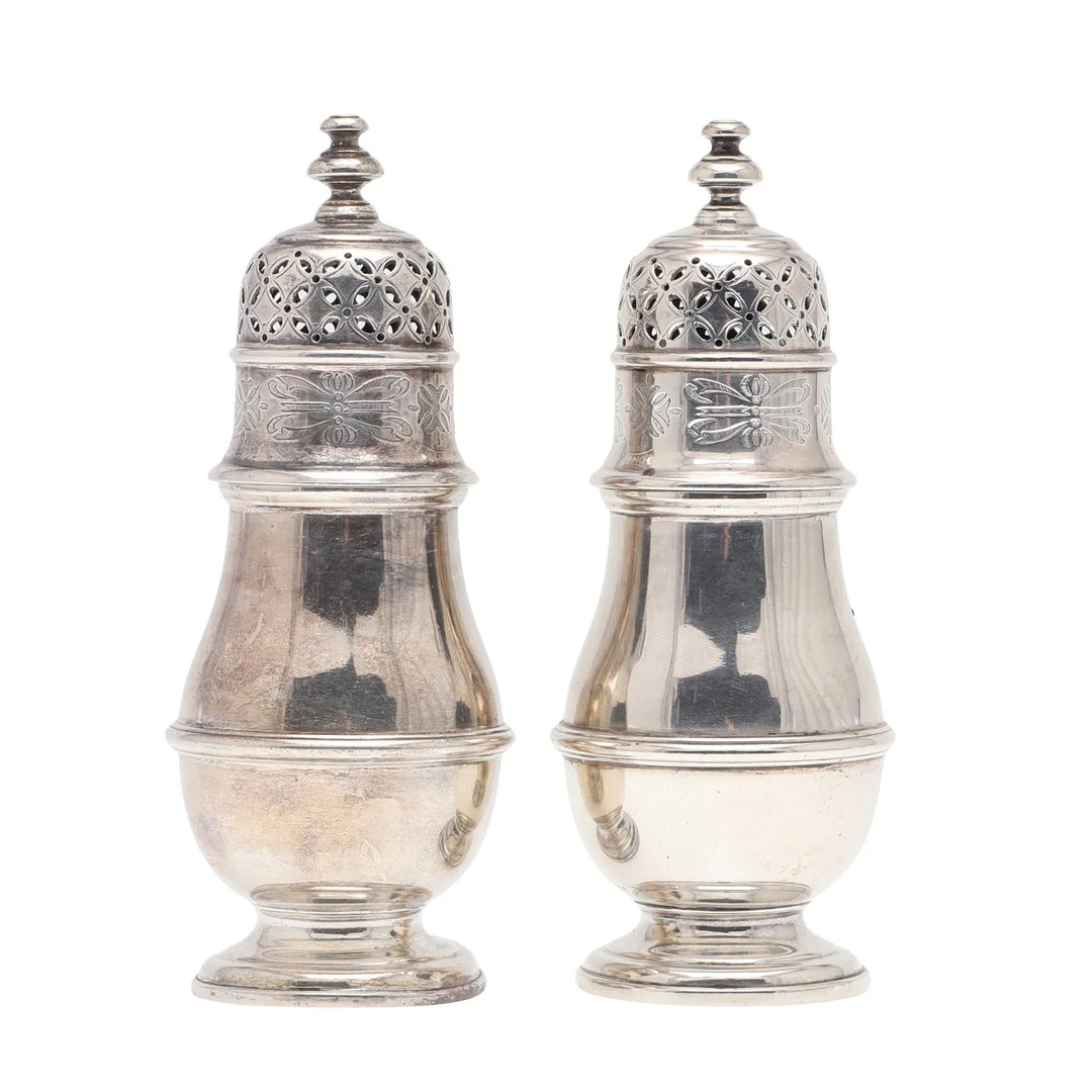 A PAIR OF EARLY 20TH CENTURY SILVER SUGAR CASTERS. — Silver — Lawrences Auctioneers