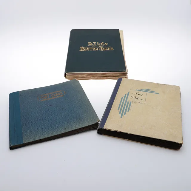 TWO TOPOGRAPHICAL POSTCARD ALBUMS, TOGETHER WITH AN ATLAS OF THE BRITISH ISLES.