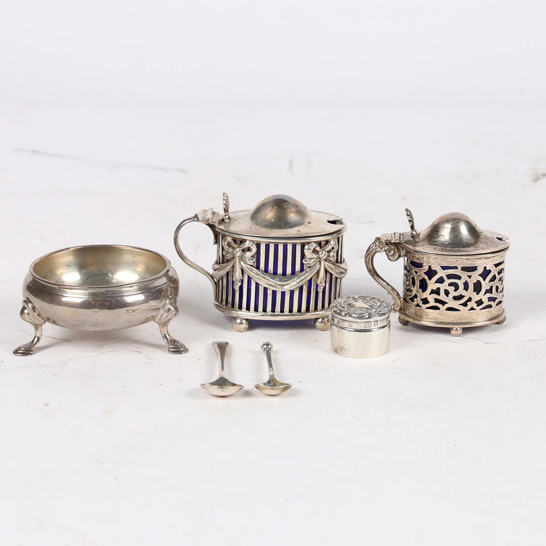 TWO SILVER MUSTARD POTS, A SILVER SALT, A MINIATURE POT AND COVER (4). — Silver — Bishop & Miller