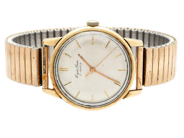EIGER LUXE, herrur, 34 mm, guld på stål, manuell, plexiglas, skadad urtavla, defekt, ca 1965, metallänk ej original.