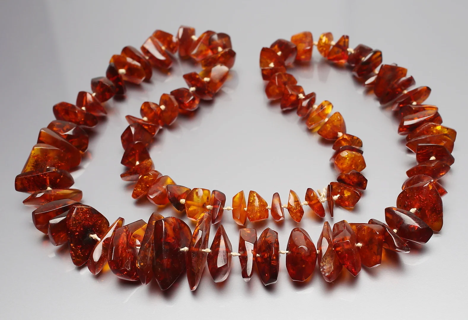 BERNSTEINKETTE. — Jewellery — Auktionshaus Dannenberg
