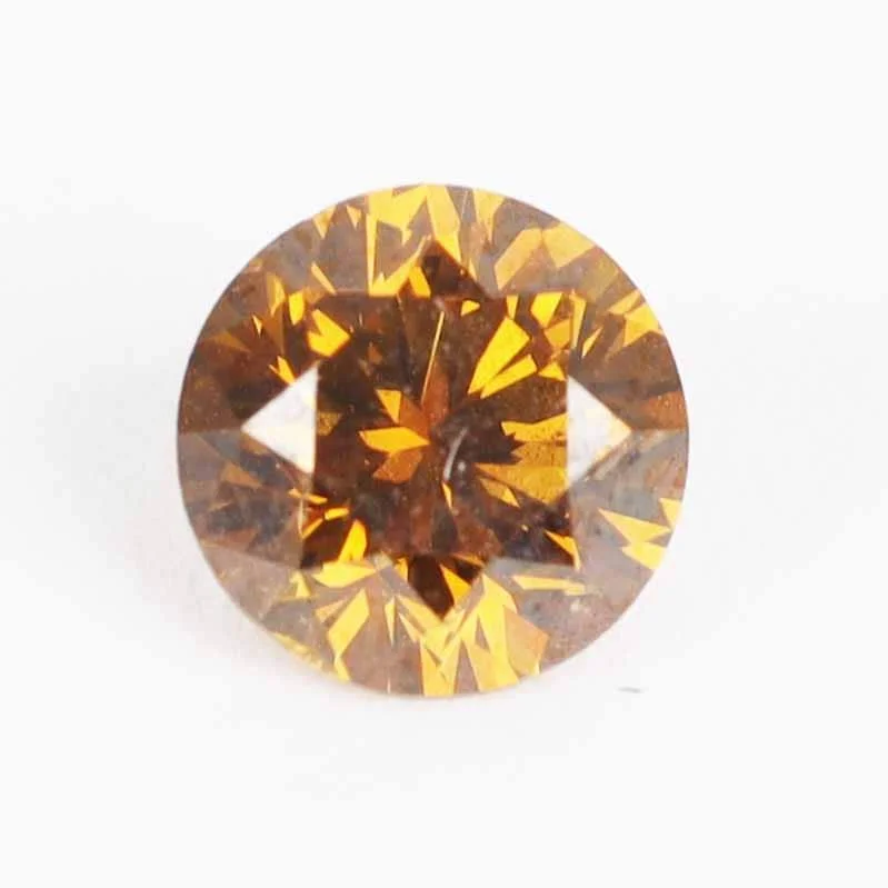 An unmounted brilliant-cut diamond 0.58 ct. Fancy deep orange brown, natural colour. — Jewellery/Diamonds, gems — Lauritz