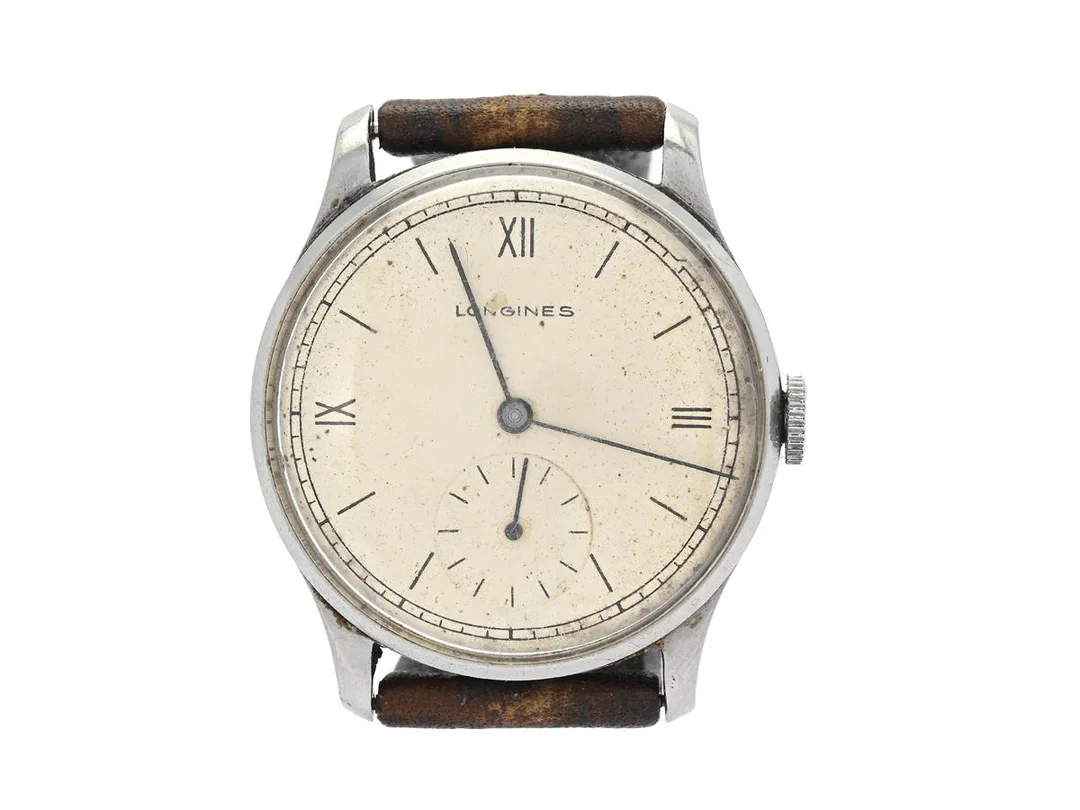 LONGINES, herrur, 32,5 mm, Cal 12.68 Z, Serie nr. 6038536, Boett nr. 21143/26, stål (staybrite), manuell, plexiglas, liten sekundvisare, skadad urtavla, skadad boett (borrade bandhorn), läderband, ca 1940. — Klockor/Longines — Kaplans