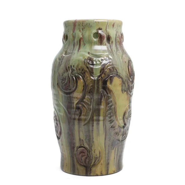 Art Nouveau earthenware vase with incised, organic pattern and pierced neck rim. Decorated with greenish-brown glaze. Signed MA & S 1919. Manufactured by Michael Andersen & Sønner, Bornholm. H. 35 cm.