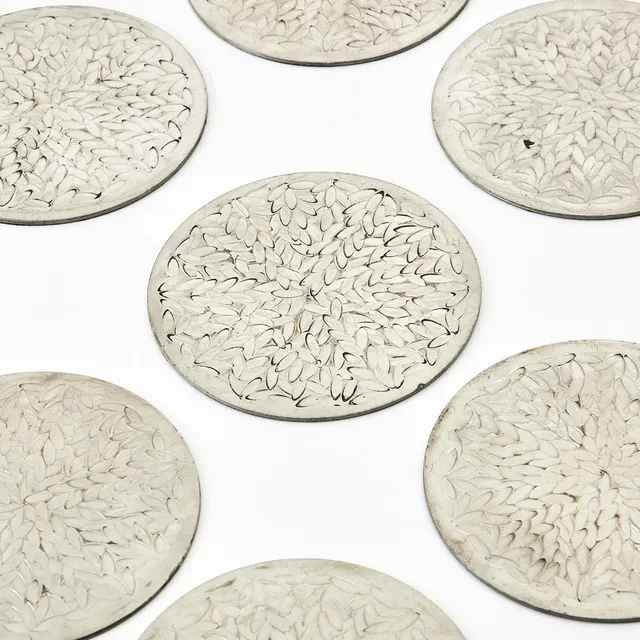 SIGNE PERSSON MELIN. "Myrten", coasters, 10 st., Firma Svenskt Tenn, tenn med reliefdekor.