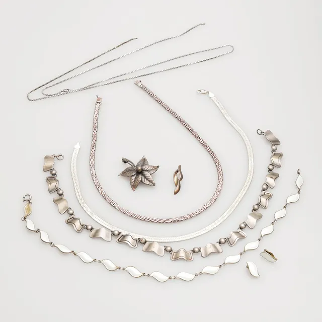 SMYCKEN, silver, 9 delar, vikt 102 gram.