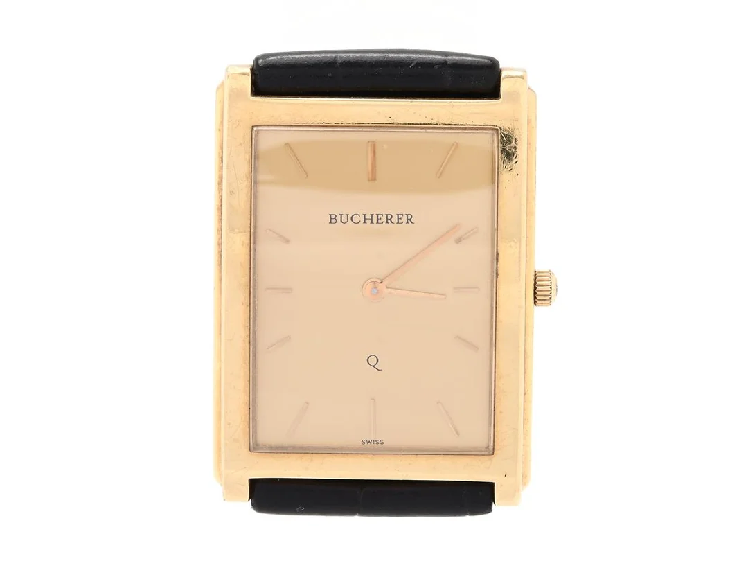 BUCHERER, herrur, 25 x 30 (34) mm, Boett nr. 959 010 / 1 7447/1, 18K guld, quartz, safirglas, läderband, ca 2000. — Klockor/Bucherer — Kaplans