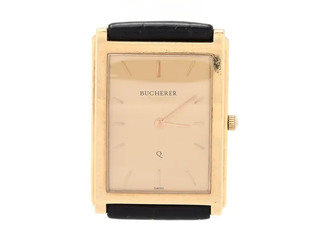 BUCHERER, herrur, 25 x 30 (34) mm, Boett nr. 959 010 / 1 7447/1, 18K guld, quartz, safirglas, läderband, ca 2000.
