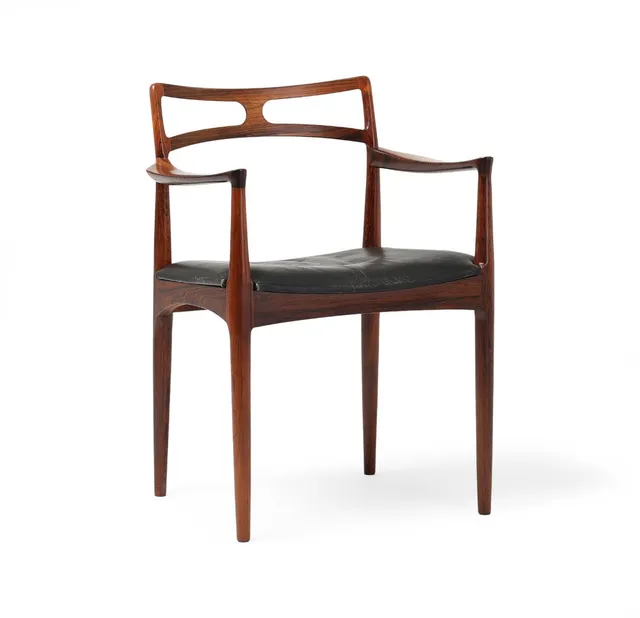 A rosewood armchair, upholstered in seat with black leather. Model 94. Manufactured by Chr. Linneberg. 1960s.