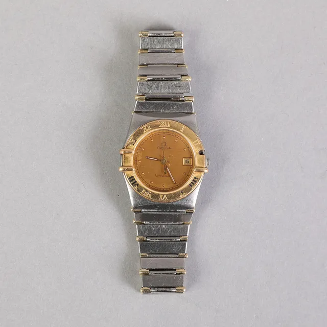 Omega Constellation dameur af guld og stål.