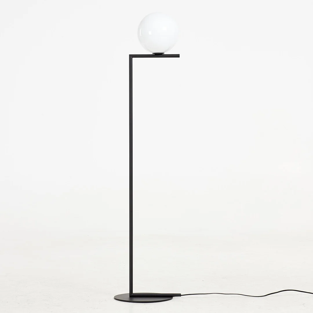 MICHAEL ANASTASSIADES. Golvlampa, "IC lights F1", Flos, kupa i opalglas, stomme i svartlackerad metall. — Floor lights — Stockholms Auktionsverk Sickla