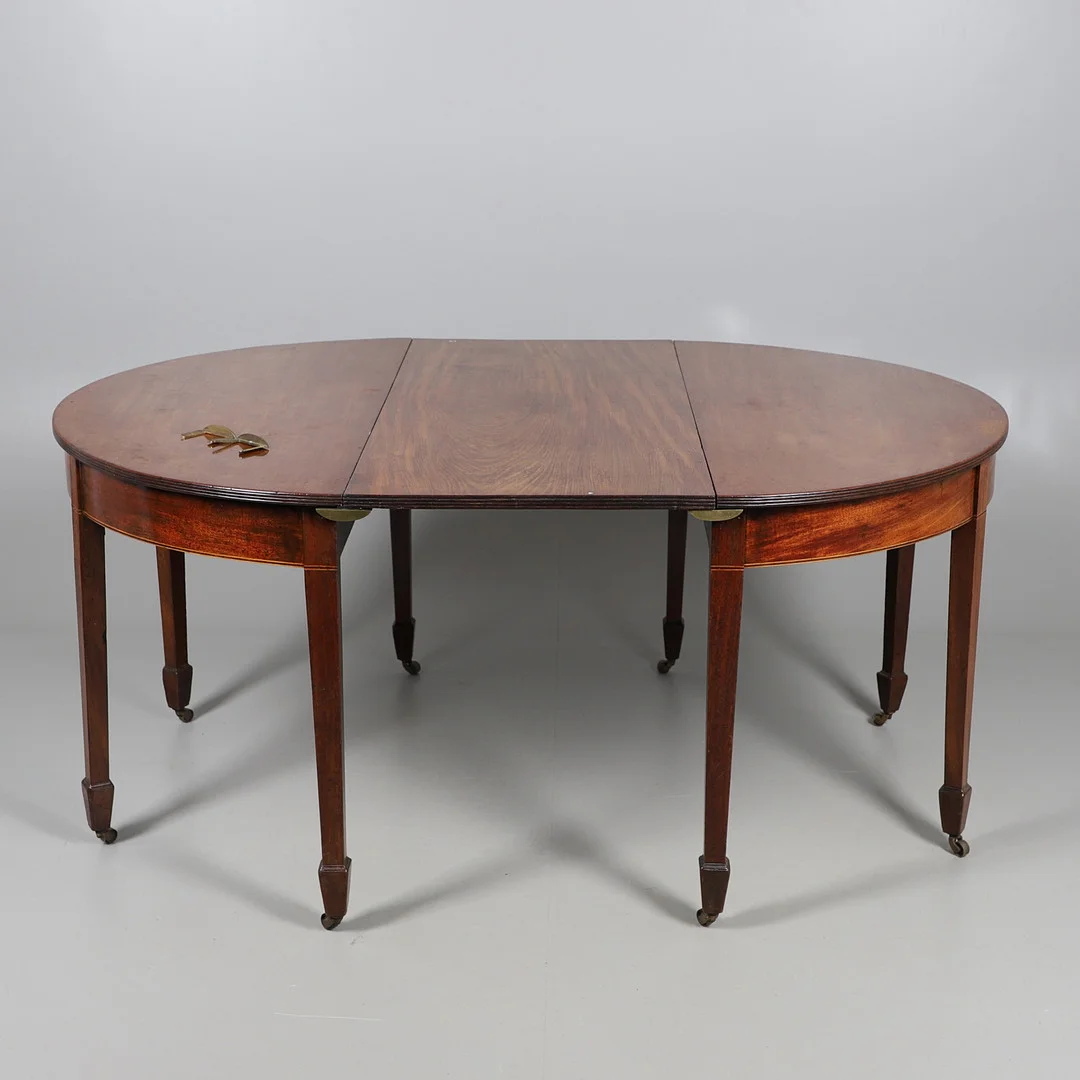 A GEORGE III MAHOGANY D-END DINING TABLE. — Tables — Lawrences Auctioneers