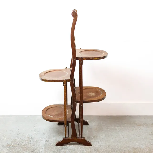 A MAHOGANY EDWARDIAN FOLDING CAKE STAND.