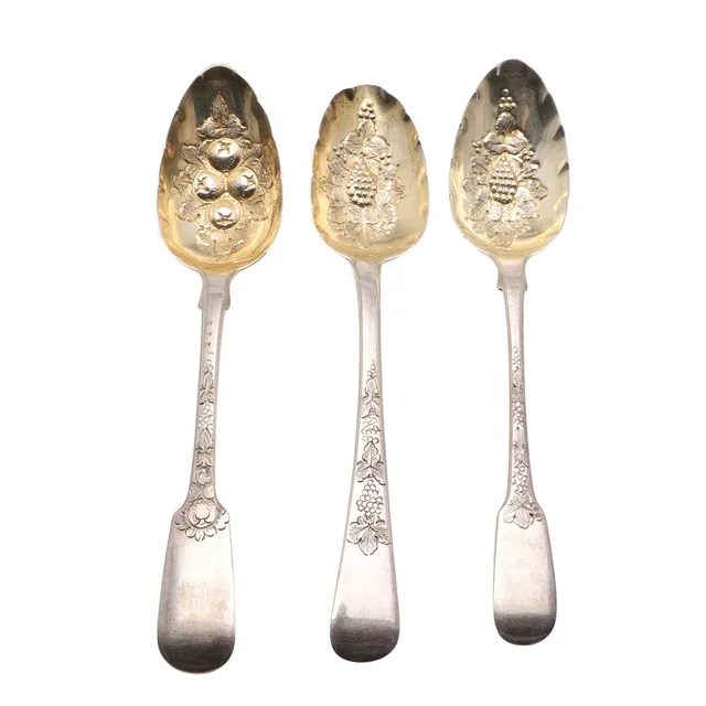 THREE 19TH CENTURY SILVER BERRY SPOONS.