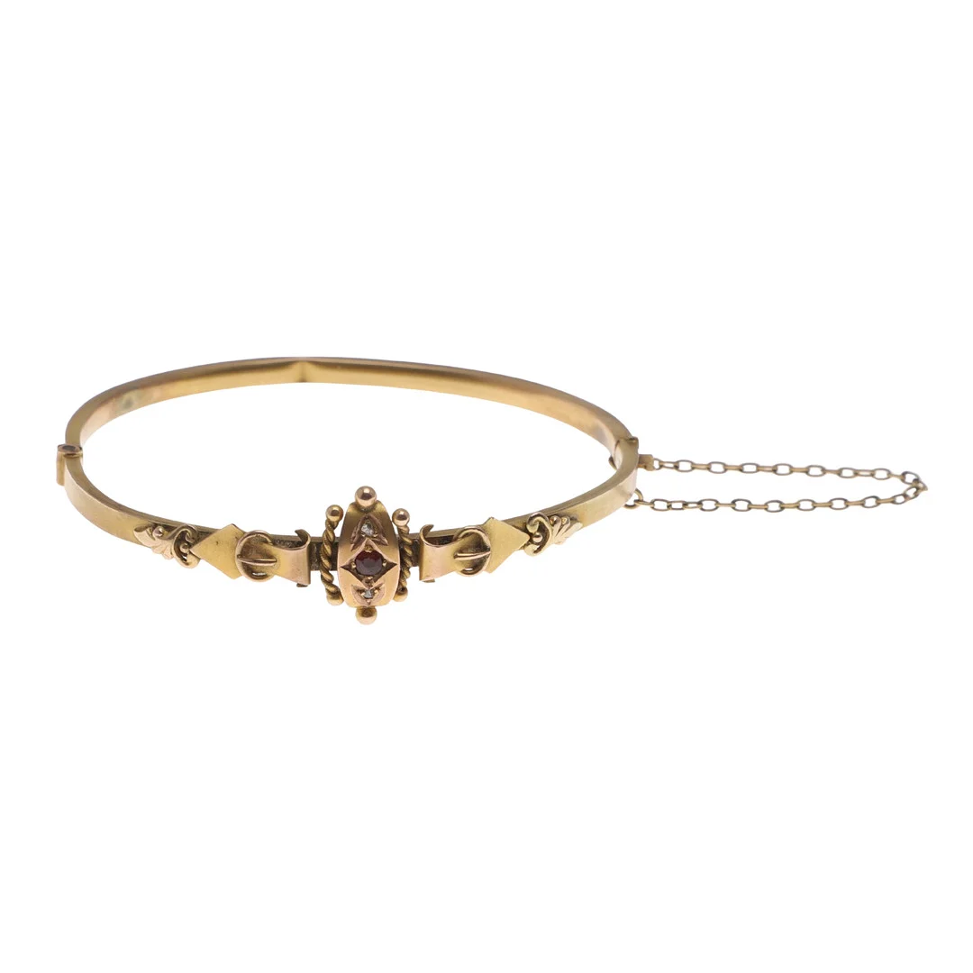A LATE VICTORIAN 9CT GOLD, RUBY AND DIAMOND BANGLE. — Bracelets — Lawrences Auctioneers