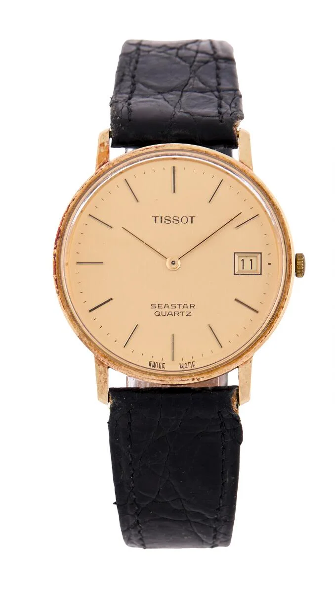 Seastar of 14k gold. Quartz movement with date. Black alligator strap with later gilt C-clasp. Ø 34 mm. 1990s. — Clocks & watches/Wristwatches — Bruun Rasmussen