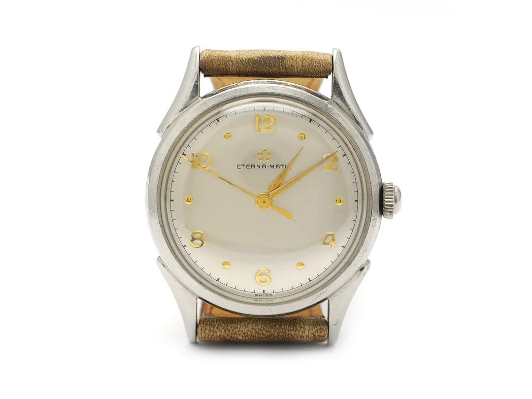 ETERNA-MATIC, herrur, 33 mm, Cal ETA 1256, Boett nr. 210907, stål, automatisk, plexiglas, skadad urtavla, läderband, ca 1953. — Klockor/Eterna — Kaplans