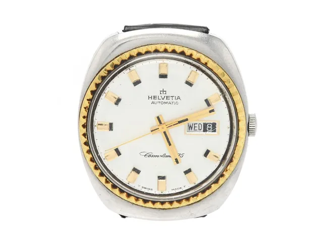 HELVETIA, Cosmotimer 75 (T Swiss Made T), Cal 879 (ETA 2639), Boett nr. 87902 / 5916593 / 49, herrur, 37 mm, bicolour, automatisk, plexiglas, dag, datum, skadad ställaxel, läderband, ca 1970.