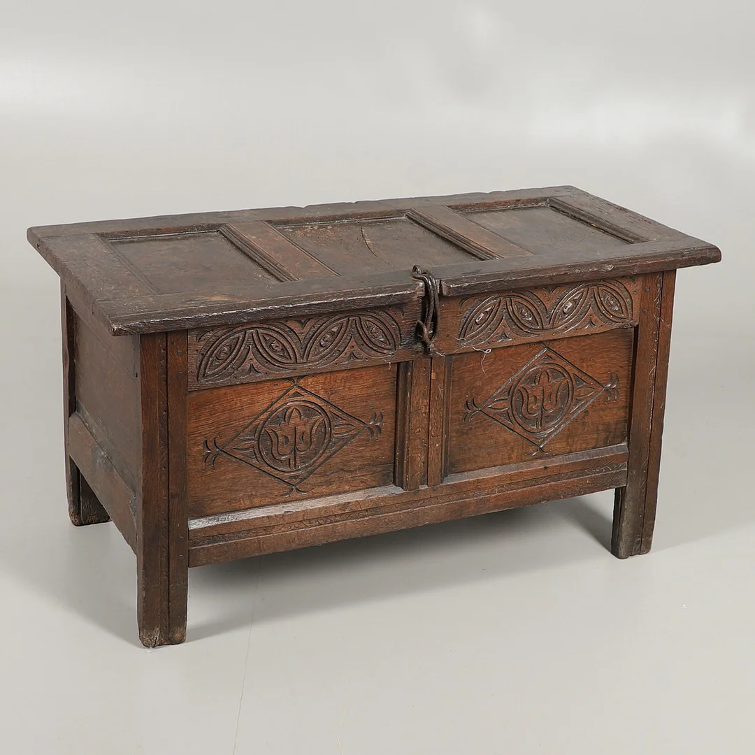 A 17TH CENTURY CARVED OAK COFFER. — Other — Lawrences Auctioneers