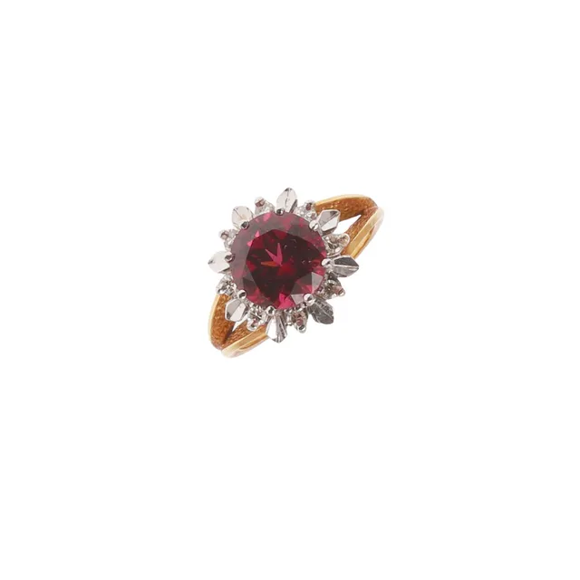 A GARNET AND DIAMOND RING.