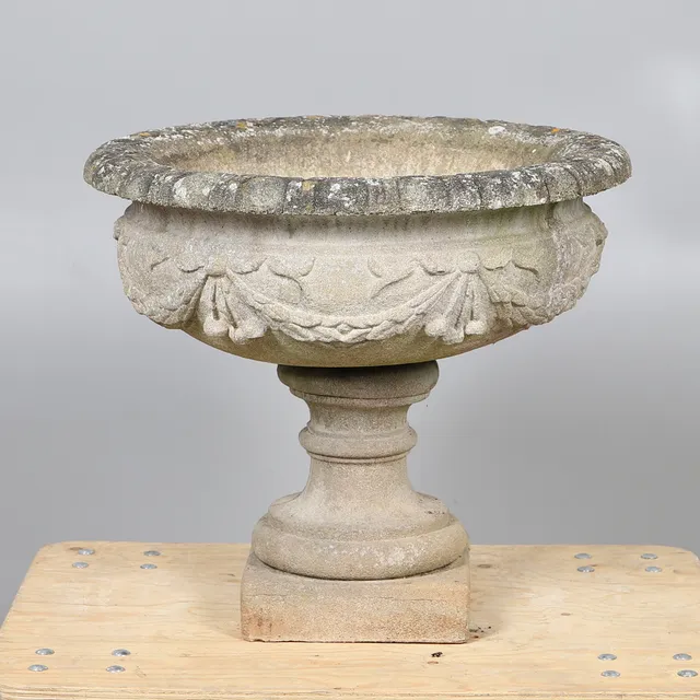 A CONCRETE CHERRY URN.