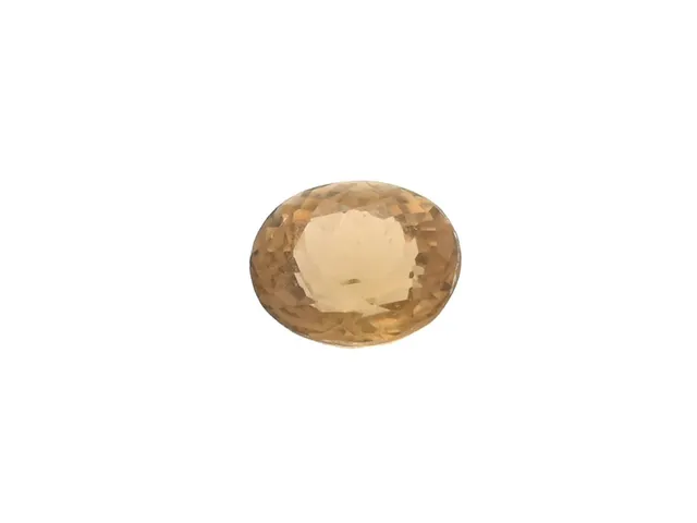 TURMALIN, gul/brun, ovalslipad 0,71 ct, mått 4.88 x 5.82 x 3.61 mm.
