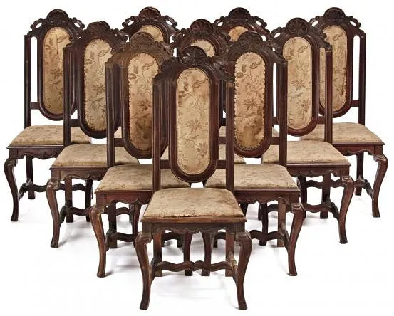 Set of ten Philip V-Ferdinand VII chairs of English style in carved walnut, second third of the 18th Century.
