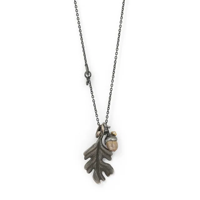 A necklace set with two pendants “Forest” pendants, a leaf, acorn with a diamond, mounted in sterling silver. L. 72 cm. Made by Ole Lynggaard. (3)