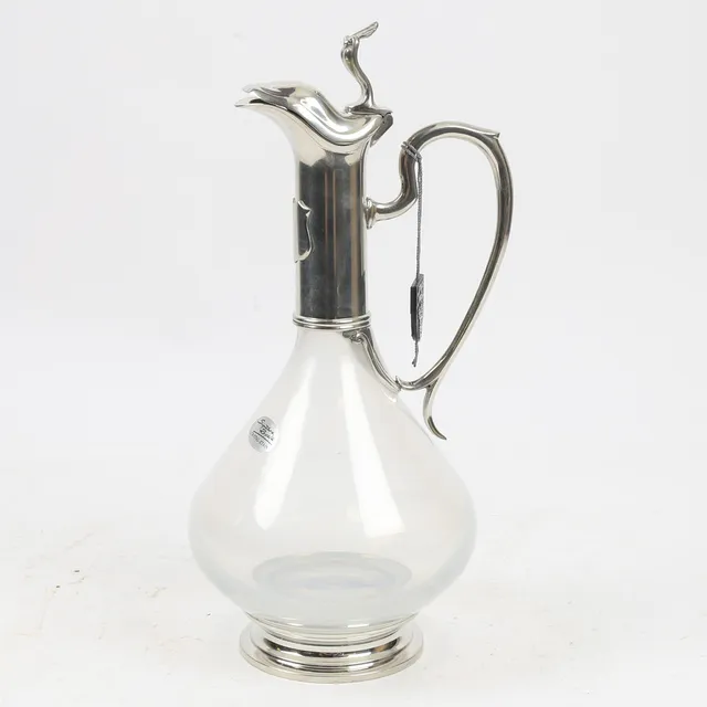 AN ART NOUVEAU ETAIN FRANCE PEWTER AND CRYSTAL CLARET JUG.