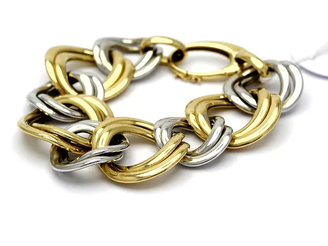 Armband 18K 27,4g tvåfärgat 20,5cm småskador