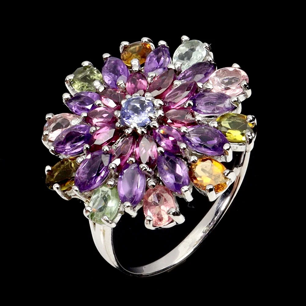 Ring in rhodium-plated sterling silver adorned with numerous tourmalines, tanzanites, pink garnets and amethysts. — Jewellery/Rings — Lauritz