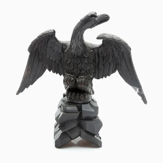 "Eagle", in carved and ebonised wood, 20th Century.