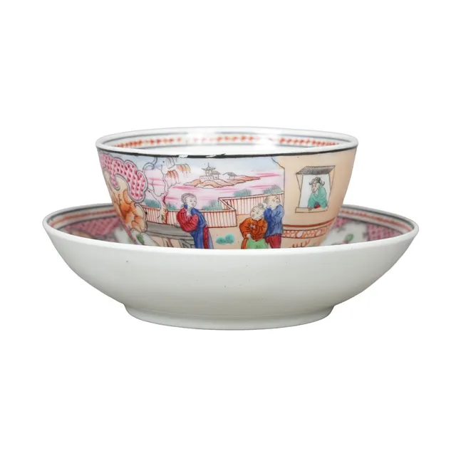 A NEWHALL PORCELAIN "BOY AT THE WINDOW" TEA BOWL AND SAUCER, CIRCA 1810 (2).