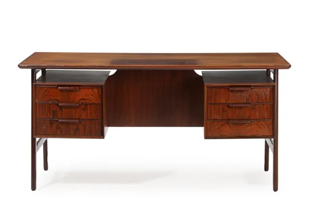 Freestanding rosewood desk with floating top, front with six drawers, reverse side with bookcases and compartment. Model 75. Manufactured by Omann Jun's Møbelfabrik, Ølholm. H. 73. L. 154. W. 81 cm.