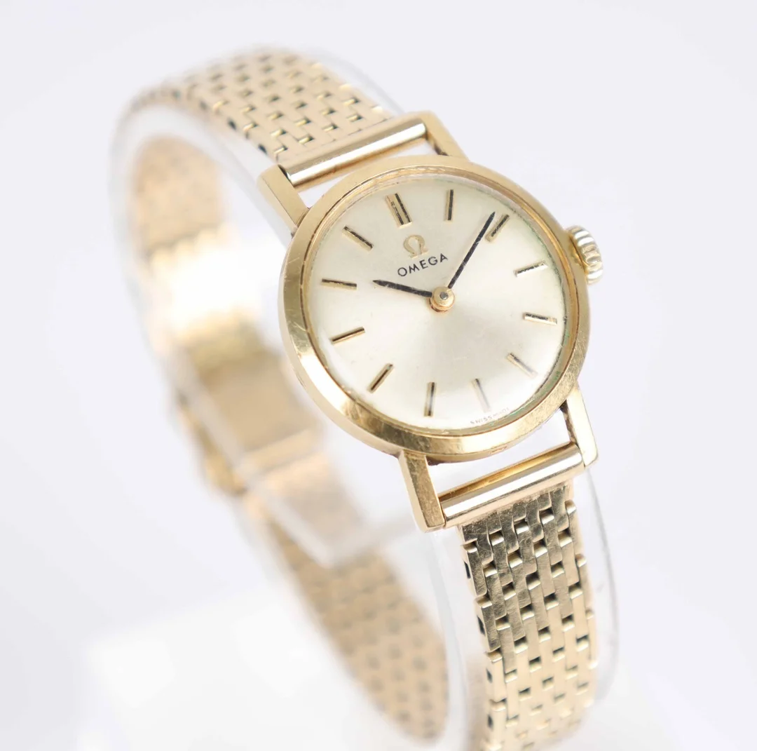 Omega women's watch of 18 and 14 kt. gold, 26.7 g. — Watches and clocks/Ladies watches — Lauritz