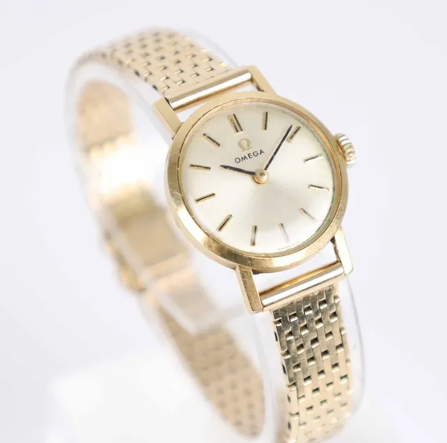Omega women's watch of 18 and 14 kt. gold, 26.7 g.