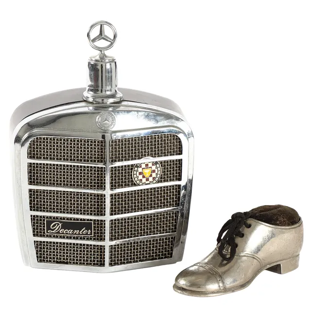 Mercedes Decanter w/ stopper in the shape of 'front grill'. 1900 / 2000s. (2)