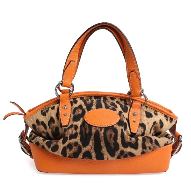 A bag of leopard print canvas with orange leather trimmings, silver tone hardware, two handles, one compartment with zipped pocket and dark brown lining. H. 20. W. 30. D. 15 cm.