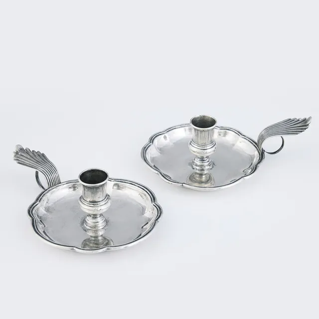 JOHAN PETTERSSON BERG. A pair of silver chamber candlesticks, Norrköping 1747. Early Rococo.